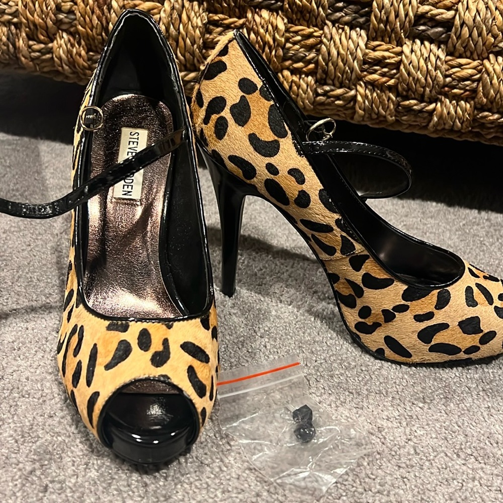 Woman’s leopard print peep toe heels